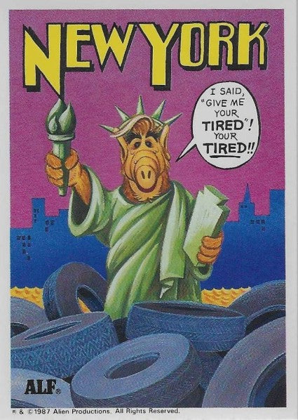 U.S. of ALF New York sticker featuring ALF dressed as Statue of Liberty in green robe and crown rising from sea of rubber tires with NYC skyline