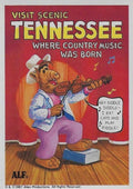 U.S. of ALF Tennessee sticker featuring ALF in white cowboy hat and sequined vest playing fiddle on stage singing hey diddle diddle I eat cats and play fiddle