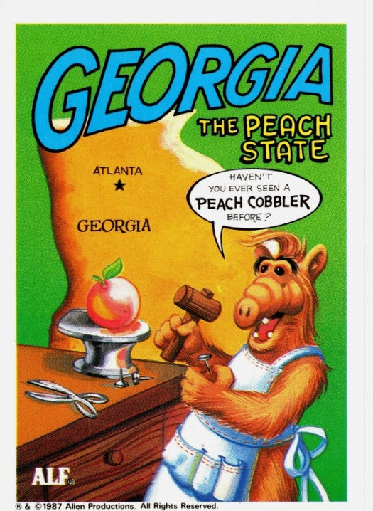 U.S. of ALF Georgia sticker featuring ALF in cobbler apron hammering a peach on a workbench saying haven't you seen a peach cobbler before
