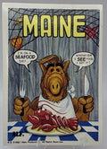 U.S. of ALF Maine sticker featuring ALF with bib fork and knife about to eat a nervous lobster at a restaurant table