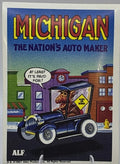 U.S. of ALF Michigan sticker featuring ALF driving a vintage dark blue Model T car with Alien on Board sign saying at least its paid for