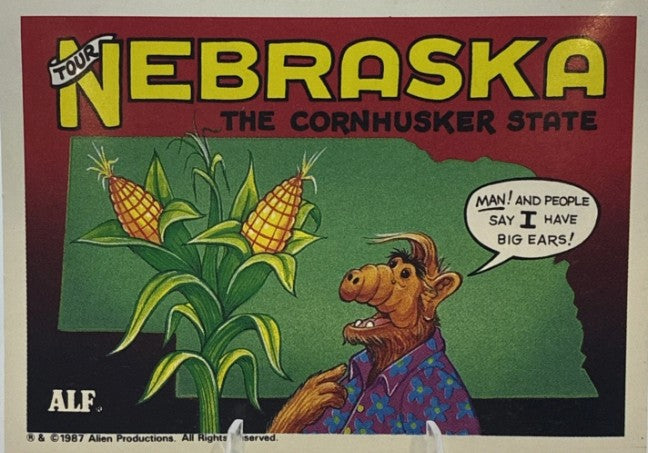 U.S. of ALF Nebraska sticker featuring ALF in floral shirt staring at giant corn stalks saying man and people say I have big ears