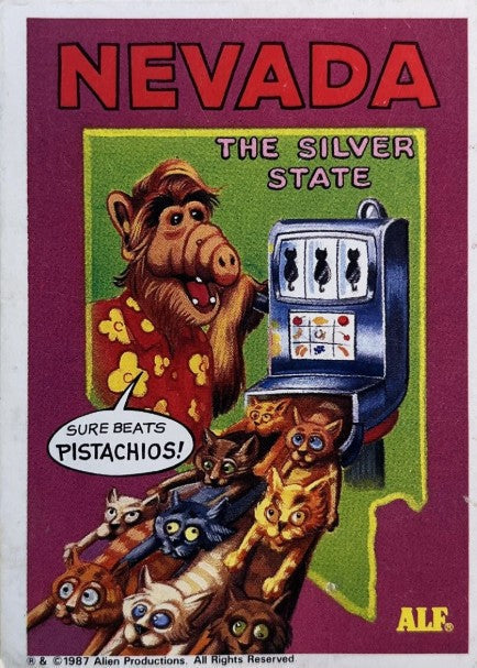 U.S. of ALF Nevada sticker featuring ALF in floral shirt at slot machine with cats spilling out as jackpot saying sure beats pistachios